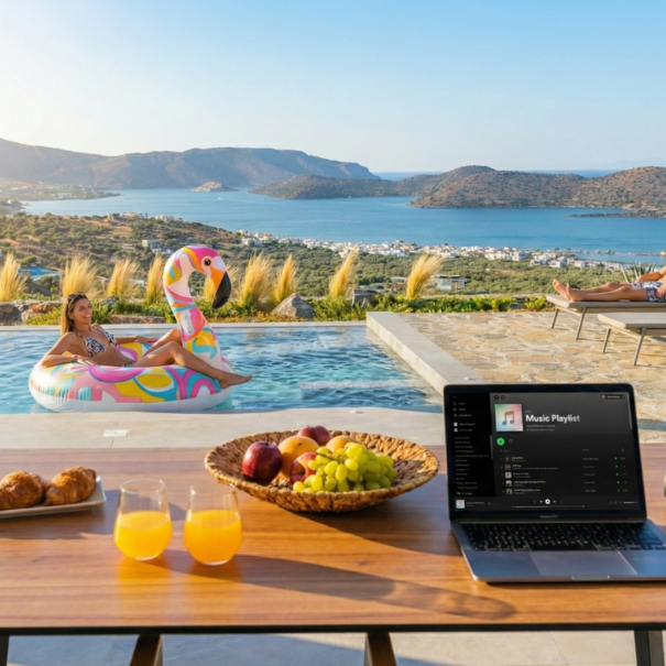 Private pool with sea view in Elounda, outdoor dining and relaxation area for families and friends.